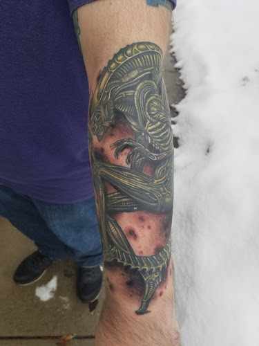 Hand & Heart Tattoo in Sterling Heights, MI